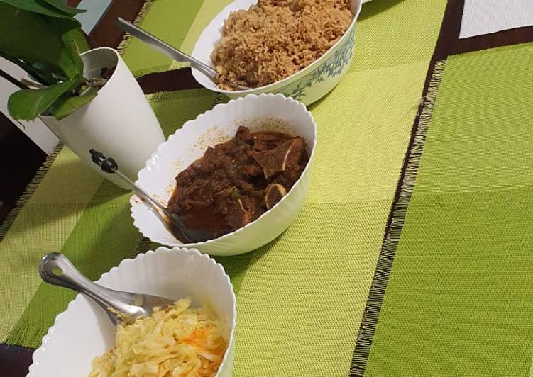 Pilau, beef stew, carroted cabbage and chapati