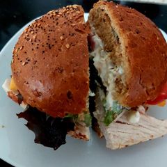 A picture of My cooked Turkey, Cheese, lettuce,Tomato & Mayo, Crusty Cob.