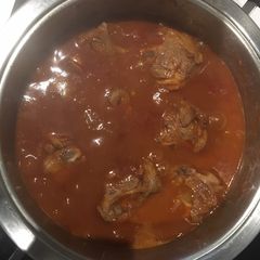 A picture of Mutton curry and baked beans.