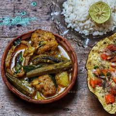 A picture of Bhindi mustard fry with dry raw mango.