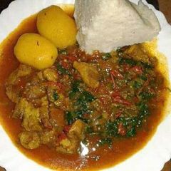 A picture of Beef stew with Ugali and Sukuma wiki.