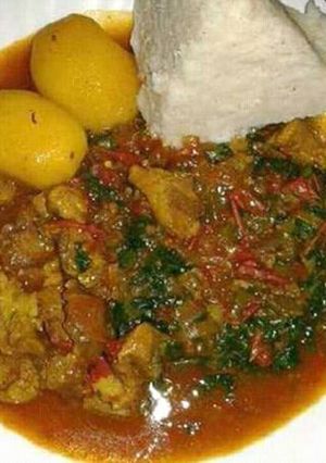 A picture of Beef stew with Ugali and Sukuma wiki.