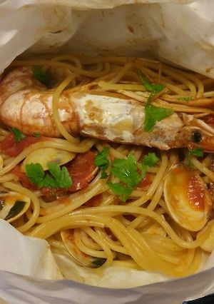 A picture of Spaghetti ai frutti di mare al cartoccio.