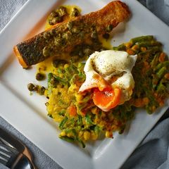A picture of Salmon, Veggie Fritters & Poached Egg With A Dill Butter Sauce.