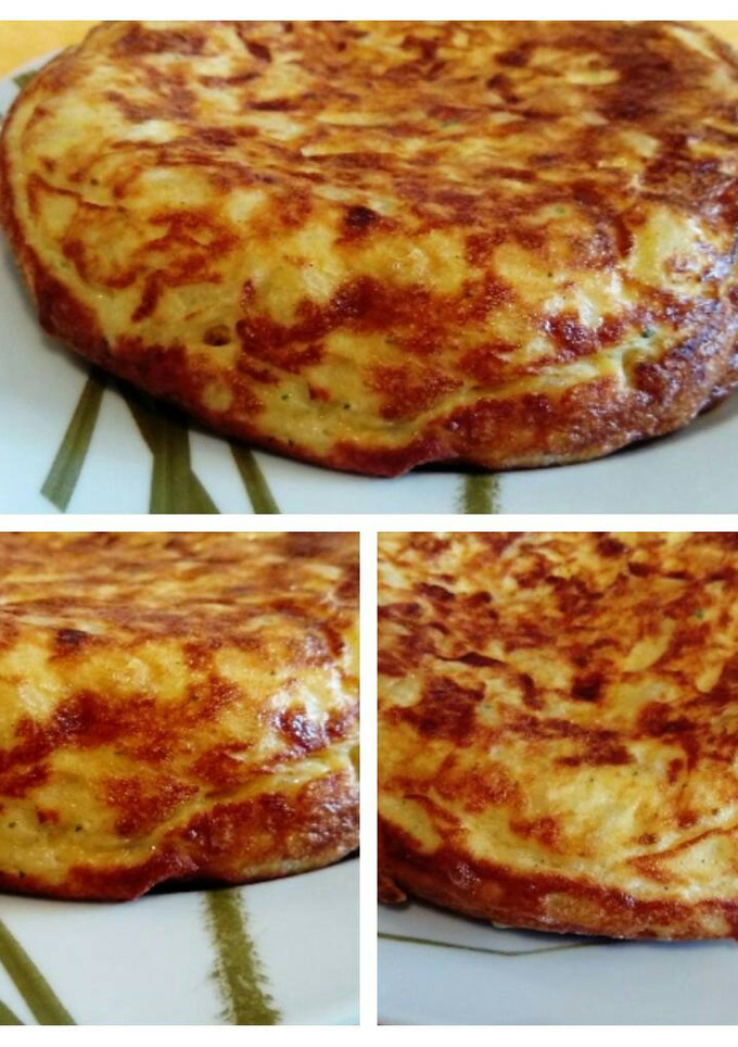 Una foto de La tortilla de patatas perfecta con cebolla...🍻