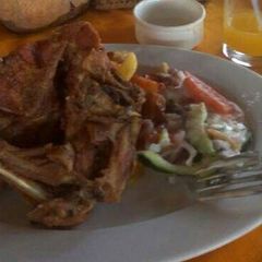 A picture of Deep fried chicken with Fries and Mayo salad.