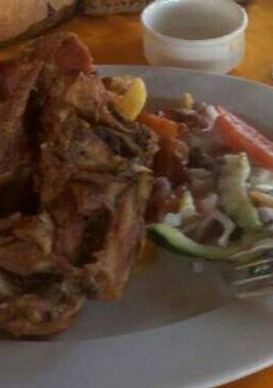 A picture of Deep fried chicken with Fries and Mayo salad.
