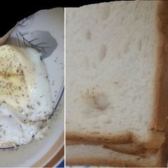 A picture of Half fried egg with  bread for breakfast.