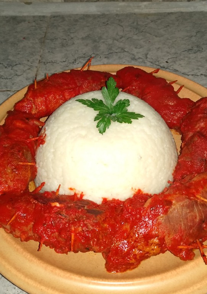 Una foto de Niños envueltos con timbal de arroz