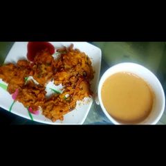 A picture of Kandha bhajia with ginger masala tea.