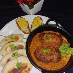 Vegetarian Potato egg curry with butter kulcha A picture of Vegetarian Potato egg curry with butter kulcha.