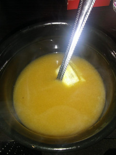 A picture of Chicken bone broth w/ thyme & lemon.