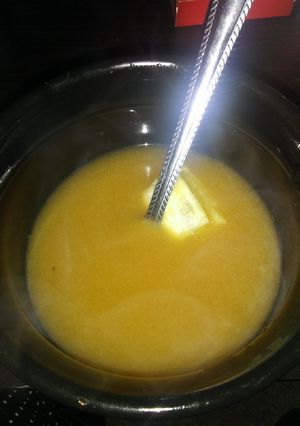 A picture of Chicken bone broth w/ thyme & lemon.