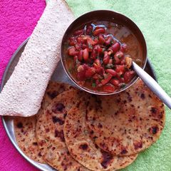 A picture of Rolled Gold - Paneer Potato Paratha (with Rajma Curry).