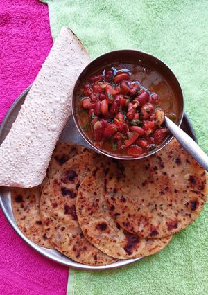A picture of Rolled Gold - Paneer Potato Paratha (with Rajma Curry).