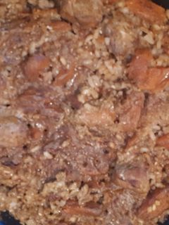 Una foto de Arroz pipián rojo con cerdo y calabaza