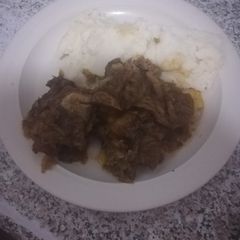 A picture of Pap and beef bones with cabbage.
