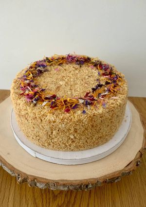 A picture of Napoleon cake with crème anglaise and white chocolate cream.