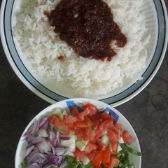White rice with stew and salad A picture of White rice with stew and salad.