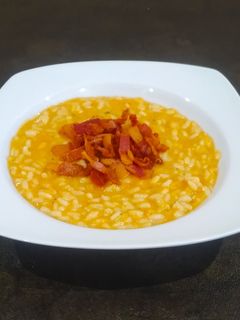 Foto di Risotto con crema di zucca e guanciale croccante