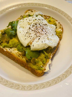A picture of Avocado toast with poached egg.