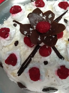 A picture of White forest cake#mycreativewhiteforestrecp.chocolate flower.