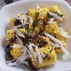 A picture of Khandvi(Gujarati Dish).