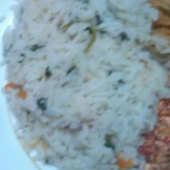 A picture of Vegetable rice, Fried Eggs and fried Cabbage  and Mango juice.