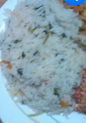 A picture of Vegetable rice, Fried Eggs and fried Cabbage and Mango juice.