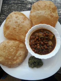 A picture of Chickpeas,Poori n Chutney.
