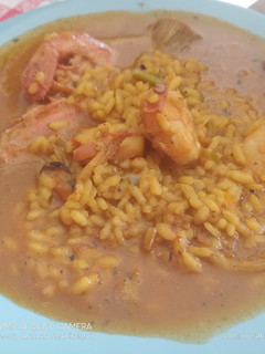 Una foto de Arroz caldoso de mar y campo