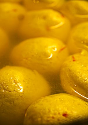 A picture of Kesar Bhog or Saffron-flavored Rasgulla.