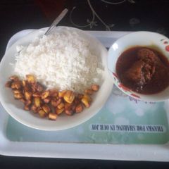 White and stew with fried plantain A picture of White and stew with fried plantain.