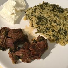 A picture of Pork with spinach rice & greek feta.