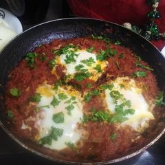 Shakshuka with meethi lassi A picture of Shakshuka with meethi lassi.