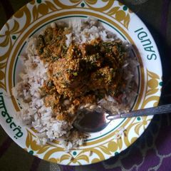 A picture of Rice,beans and egusi soup.