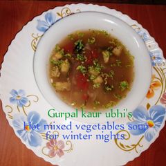 A picture of Hot mixed vegetables soup for winter nights ❄️🍆🍅🧅.