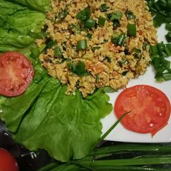 A picture of Eggs with veggies.