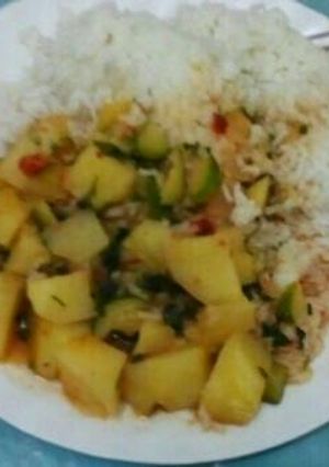 A picture of Rice and stew for two people.