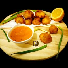 A picture of Instant Mysore Bonda With Yummy spicy Red Chutney.