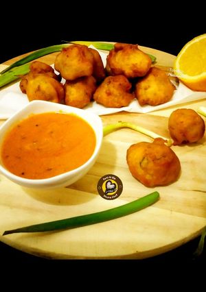 A picture of Instant Mysore Bonda With Yummy spicy Red Chutney.