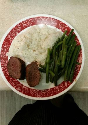 A picture of Venison Tenderloins with bacon.