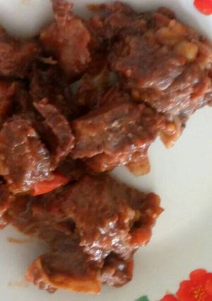 A picture of Fried beef in Tomato sauce.