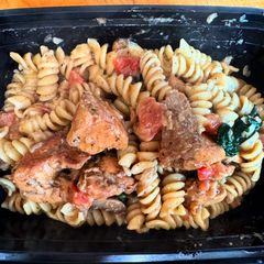 A picture of Creamy Garlic Chicken Pasta with Tomato Spinach & Mushrooms.