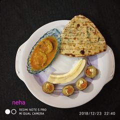 A picture of Banana kofta stuffing with carrot halwa.