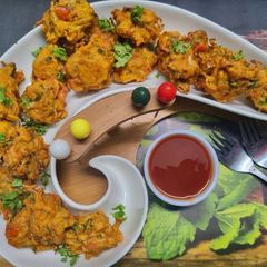 A picture of Jawla(Tiny Shrimp) and Mixed Vegetables Fritters.