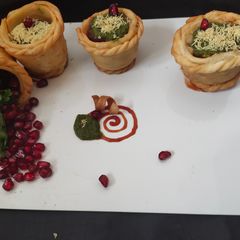A picture of Open samosa basket chat.
