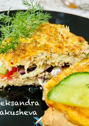 A picture of Omelette with canned tuna on toast.