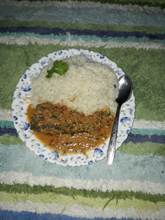 A picture of Rice and fish sauce with coconut.