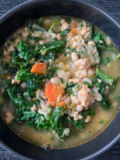 A picture of White Bean Soup with Turkey, Kale, and Lemon.